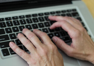 Typing on Computer Keyboard - Image by Victoria Loveland